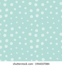 Light dots of different sizes on a light blue background in a chaotic order. Seamless pattern for any use.