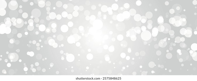 A light gray background with a bokeh style. The background features soft, white circles. The gray background is smooth and calming. Dreamy bokeh light background vector