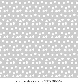 Light gray background scattered dots polka seamless pattern. Vector illustration.