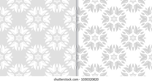 Light gray floral backgrounds. Set of seamless patterns for textile and wallpapers