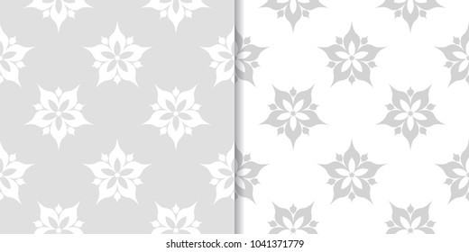 Light gray floral backgrounds. Set of seamless patterns for textile and wallpapers