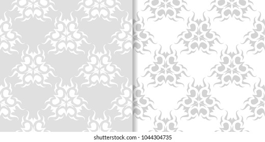 Light gray floral backgrounds. Set of seamless patterns for textile and wallpapers
