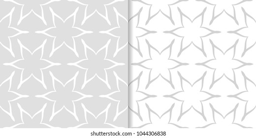 Light gray floral backgrounds. Set of seamless patterns for textile and wallpapers