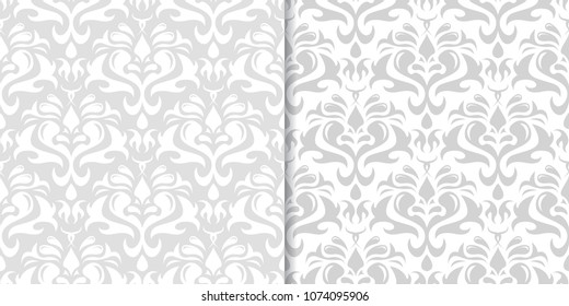 Light gray floral backgrounds. Set of seamless patterns for textile and wallpapers