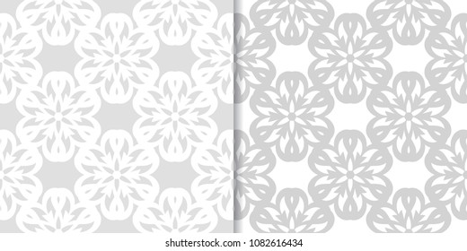 Light gray floral backgrounds. Set of seamless patterns for textile and wallpapers