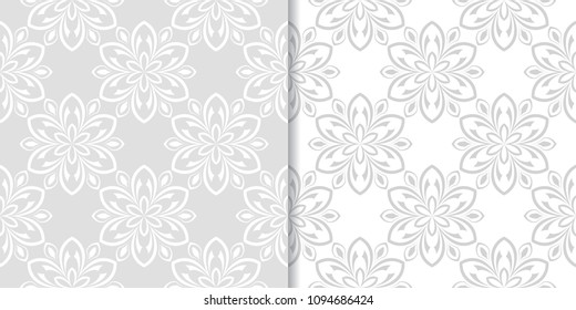 Light gray floral backgrounds. Set of seamless patterns for textile and wallpapers