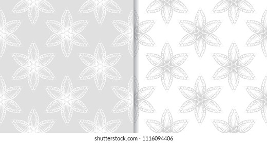 Light gray floral backgrounds. Set of seamless patterns for textile and wallpapers