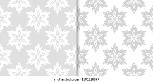 Light gray floral backgrounds. Set of seamless patterns for textile and wallpapers