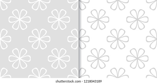 Light gray floral backgrounds. Set of seamless patterns for textile and wallpapers