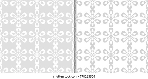 Light gray floral backgrounds. Set of seamless patterns for textile and wallpapers