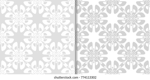 Light gray floral backgrounds. Set of seamless patterns for textile and wallpapers