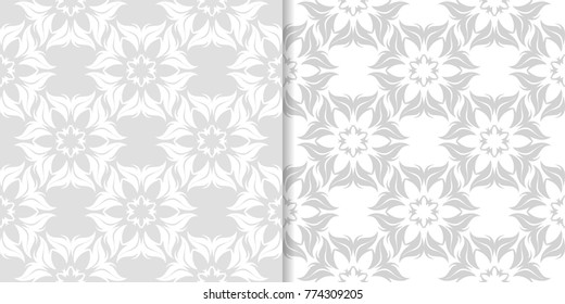 Light gray floral backgrounds. Set of seamless patterns for textile and wallpapers