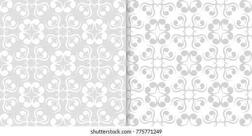 Light gray floral backgrounds. Set of seamless patterns for textile and wallpapers