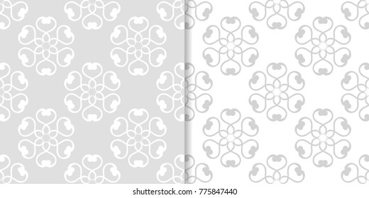 Light gray floral backgrounds. Set of seamless patterns for textile and wallpapers