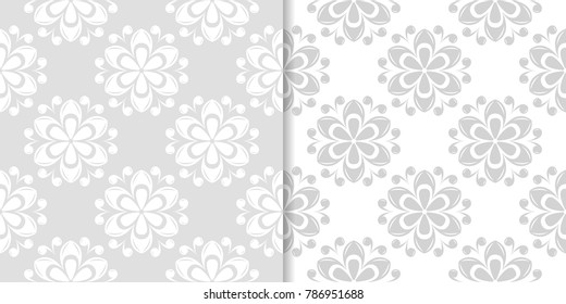 Light gray floral backgrounds. Set of seamless patterns