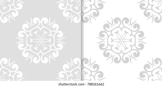 Light gray floral backgrounds. Set of seamless patterns