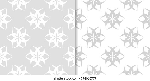 Light gray floral backgrounds. Set of seamless patterns for textile and wallpapers