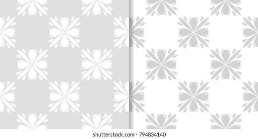 Light gray floral backgrounds. Set of seamless patterns for textile and wallpapers