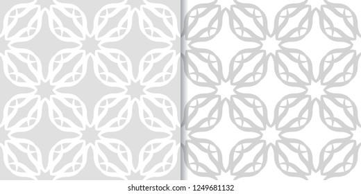 Light gray floral ornamental designs. Set of seamless patterns