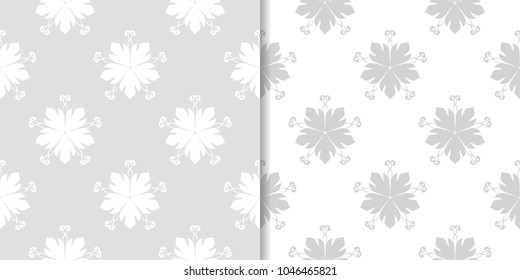 Light gray floral ornaments. Set of seamless patterns for textile and wallpapers
