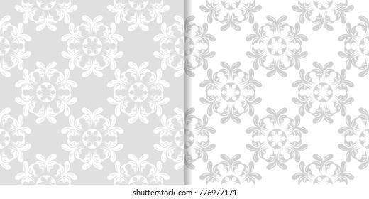 Light gray floral ornaments. Set of seamless patterns for textile and wallpapers