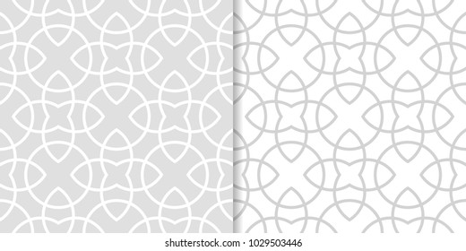 Light gray geometric ornaments. Set of seamless patterns for web, textile and wallpapers