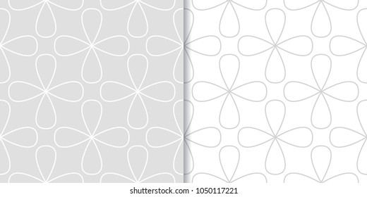 Light gray geometric ornaments. Set of seamless patterns for web, textile and wallpapers