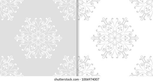 Light gray set of floral backgrounds. Seamless patterns for textile and wallpapers