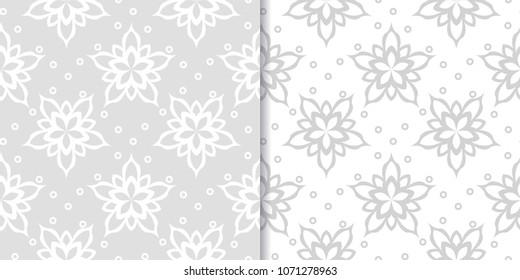 Light gray set of floral backgrounds. Seamless patterns for textile and wallpapers