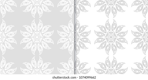 Light gray set of floral backgrounds. Seamless patterns for textile and wallpapers