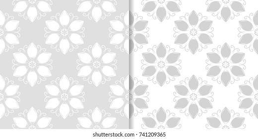 Light gray set of floral backgrounds. Seamless patterns for textile and wallpapers