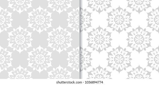 Light gray and white floral ornaments. Set of seamless patterns for textile and wallpapers