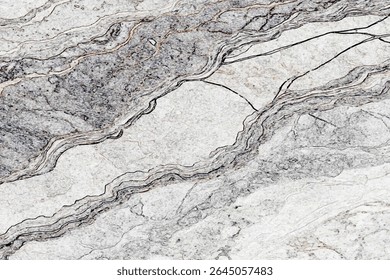  light gray and white marble stone with dark gray veins and a diagonal pattern running throughout the stone texture.