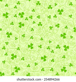 Light green St. Patrick's day background with swirls and clover leaves.