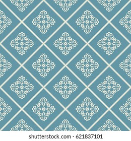 Light ornament on blue background with rhombuses. Seamless vector pattern