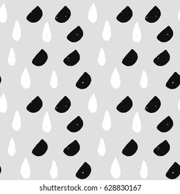 light painted color pattern of graphic black and white semi-circles drops with textures on grey background