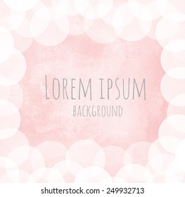 light pink watercolor background with frame of bokeh