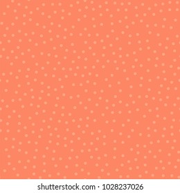Light polka dots seamless pattern on coral background.