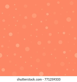 Light polka dots seamless pattern on coral background.