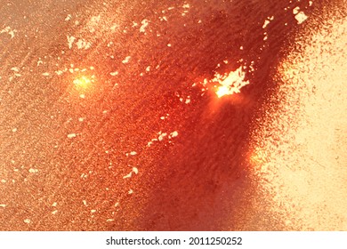 Light red and gold abstract marble pattern with sparkles. Vector background in alcohol ink technique with glitter. Template for banner, poster design. Fluid art painting
