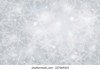 Light winter background made from snowflakes.