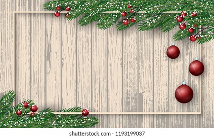 Light wooden background with fir branches, holly berries, red balls, lights and snow. Festive cute New Year 2019 Greeting Card. Traditional winter season holiday banner template. Merry Christmas 