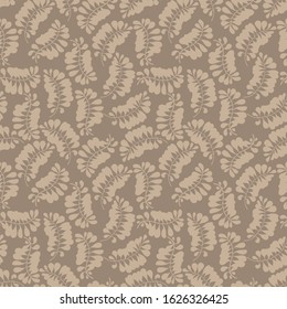 Light-beige leaves on beige background. Seamless pattern. Vector graphics.