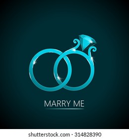 Light-Blue Colored Sparkling Wedding Rings on a Dark Background