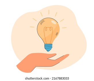 Lightbulb with glow rays on human hand flat vector illustration. Startup, idea, innovation, creativity, solution, inspiration concept for banner, website design or landing web page