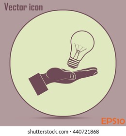 Lightbulb in hand icon vector