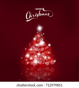 Lighted up Christmas tree with many lensflares on red background and Merry Christmas text.