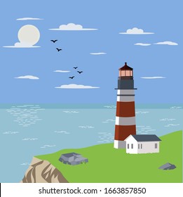 Lighthouse and house on offshore green coast with sunny weather and many birds, sunlight reflex on blue ocean sea and blue sky 