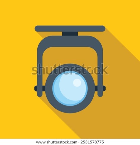 Lighting equipment hanging from the ceiling and casting light on a yellow background