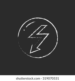 Lightning arrow downward hand drawn in chalk on a blackboard vector white icon isolated on a black background.